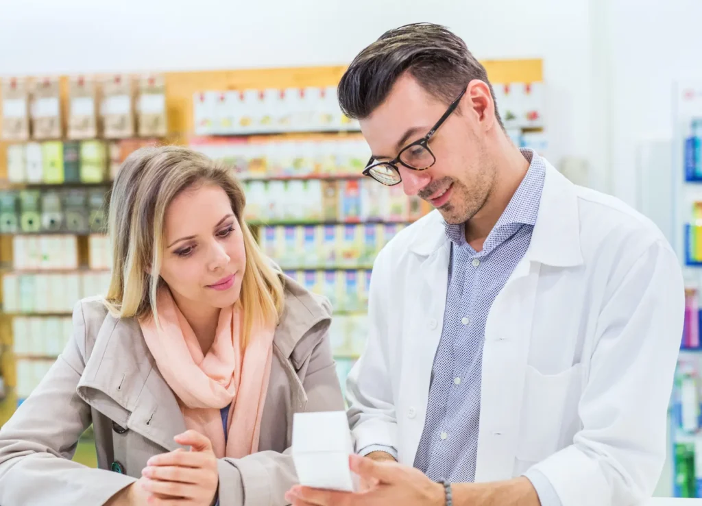 Pharmacist helping a customer at the counter